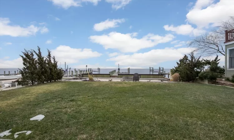 View of yard with a dock