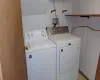 Washroom with washer and clothes dryer