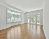 Primary bedroom with French doors to private terrace