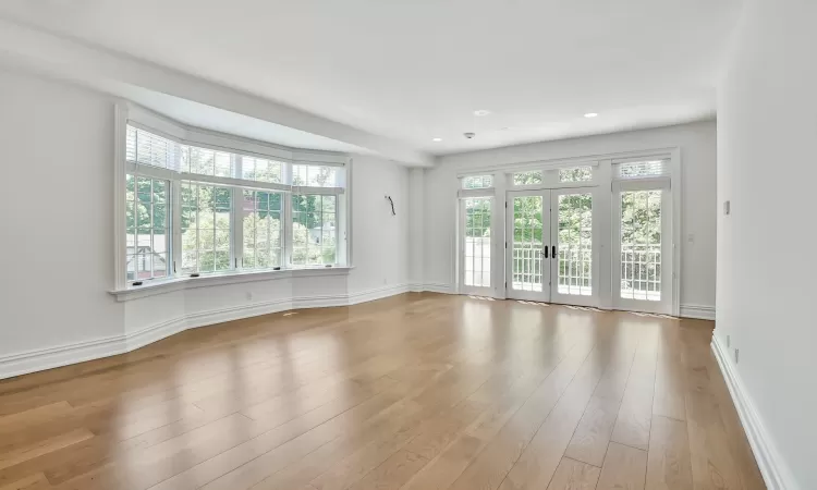 Primary bedroom with French doors to private terrace