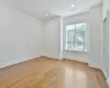 Spare room featuring light wood-type flooring