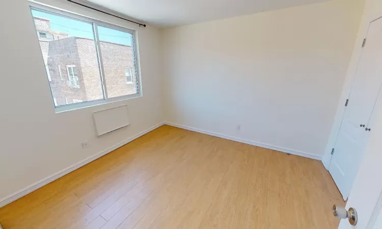 Spare room featuring light hardwood / wood-style floors