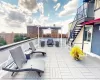 View of patio featuring an outdoor hangout area and a balcony