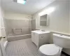 Full bathroom featuring shower / tub combination, tile patterned flooring, vanity, and toilet