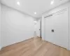 Unfurnished bedroom featuring light hardwood / wood-style flooring and a closet