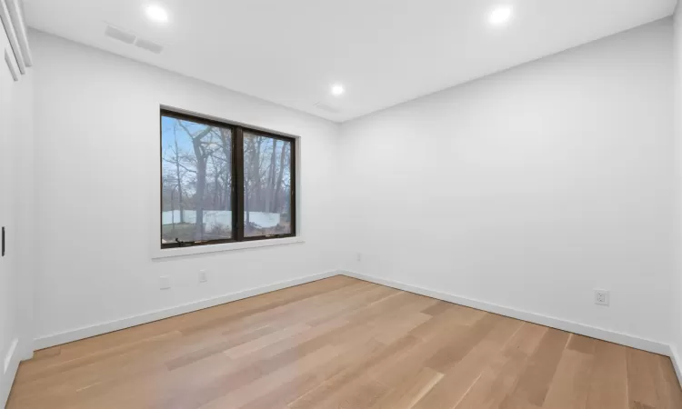 Spare room featuring light hardwood / wood-style flooring