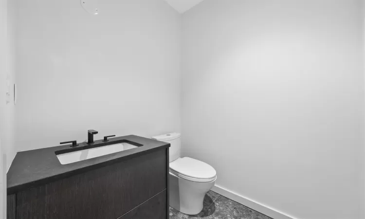 Bathroom with vanity and toilet