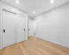 Unfurnished bedroom featuring light hardwood / wood-style floors and a closet