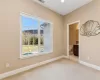 Carpeted empty room with a mountain view and a wealth of natural light