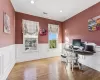 Office featuring hardwood / wood-style floors and ornamental molding