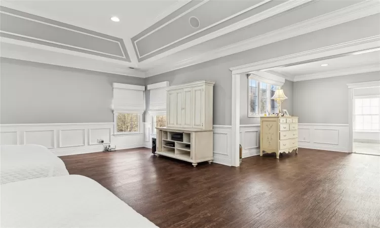 Bedroom featuring dark hardwood / wood-style floors and ornamental molding