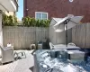 View of patio / terrace featuring a hot tub