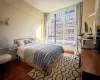 Bedroom featuring dark hardwood / wood-style flooring