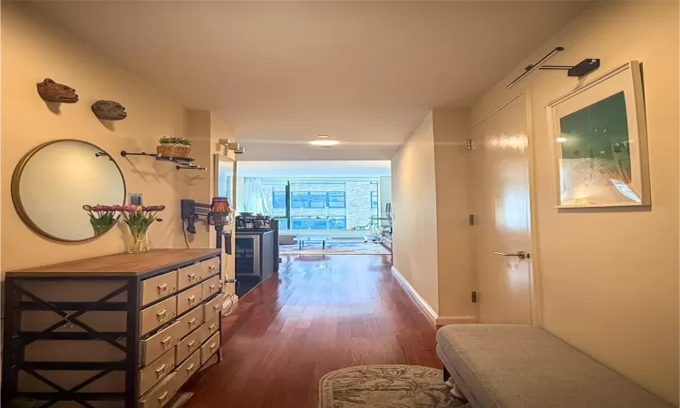 Hallway featuring dark hardwood / wood-style floors