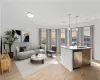 Living room featuring light hardwood / wood-style floors and sink