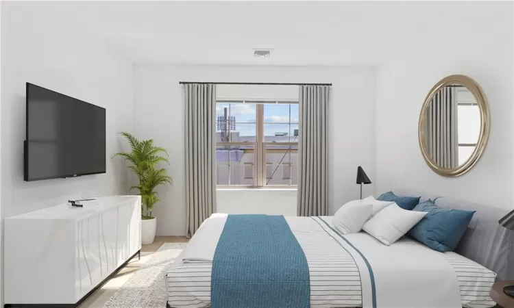 Bedroom featuring light wood-type flooring