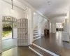 Foyer featuring dark parquet flooring and a notable chandelier