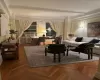 Sitting room featuring parquet flooring and ornamental molding