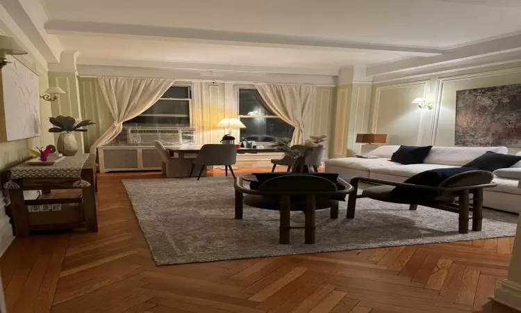 Sitting room featuring parquet flooring and ornamental molding