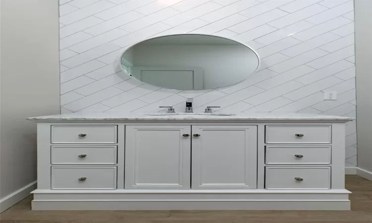 Bathroom featuring vanity and hardwood / wood-style flooring