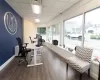 Office featuring dark hardwood / wood-style floors and a drop ceiling