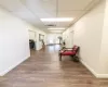 Hall with a paneled ceiling, hardwood / wood-style flooring, and french doors