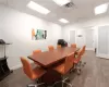 Office space featuring a paneled ceiling and wood-type flooring