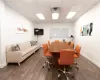 Home office featuring hardwood / wood-style floors and a paneled ceiling