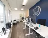 Office featuring a drop ceiling and dark hardwood / wood-style flooring