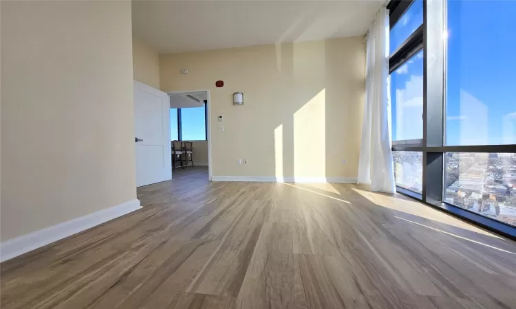 Spare room with hardwood / wood-style floors