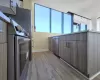 Kitchen with sink, dishwasher, refrigerator, and light wood-type flooring