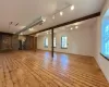 Basement featuring light hardwood / wood-style flooring and brick wall