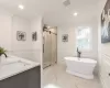 Bathroom with shower, free-standing tub, double vanity