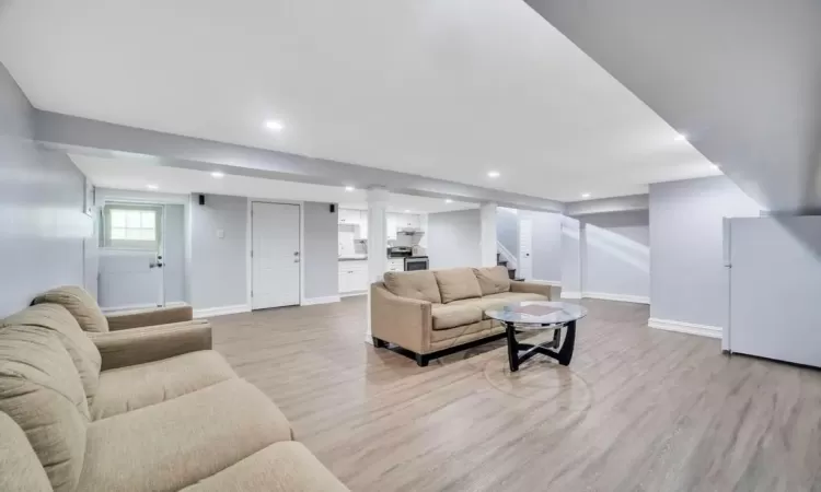 Living room with light hardwood / wood-style flooring