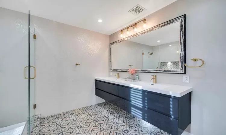 Bathroom with vanity and walk in shower