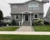 View of front of property with a front lawn