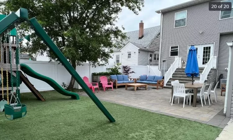 View of jungle gym with outdoor lounge area, a yard, and a patio area