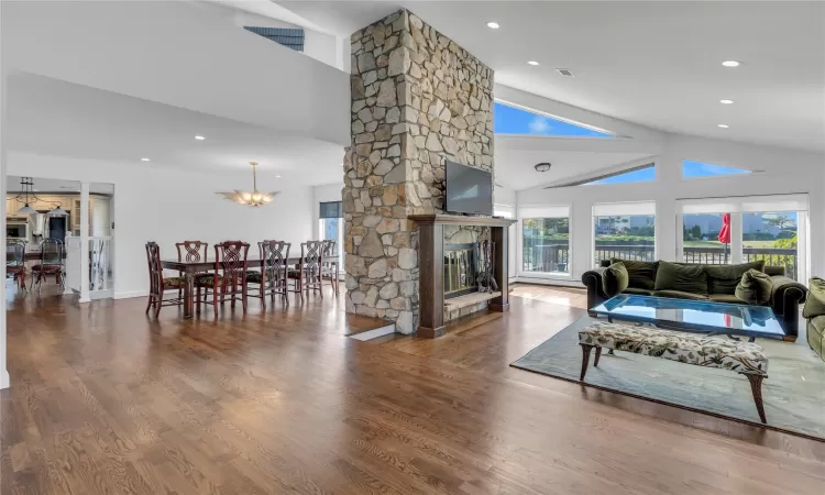 Open concept sunken Living Room with Vaulted Ceilings