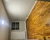 Empty room with light hardwood / wood-style floors and baseboard heating