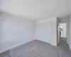 Unfurnished bedroom with light hardwood / wood-style floors and a closet