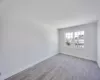 Empty room with light wood-type flooring