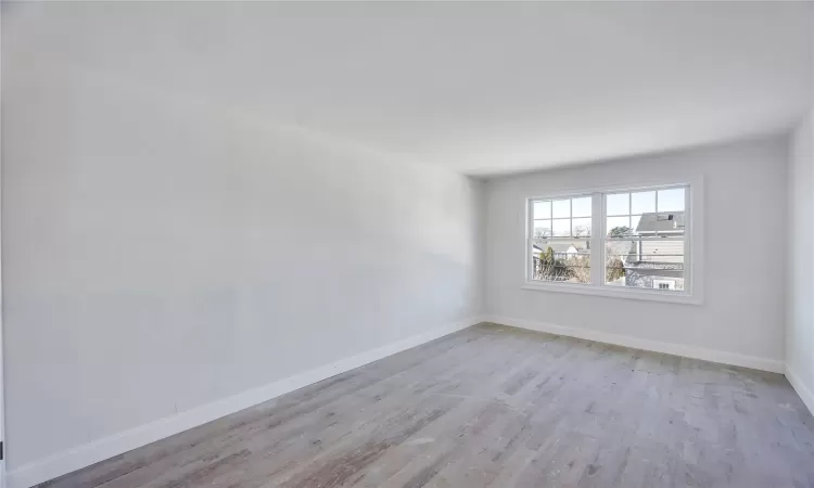 Empty room with light wood-type flooring