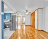 Kitchen featuring ceiling fan, light wood-type flooring, blue cabinets, and appliances with stainless steel finishes