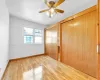 Unfurnished bedroom featuring ceiling fan, light wood-type flooring, and a closet