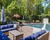 View of pool with a patio, an outdoor hangout area, and a water slide