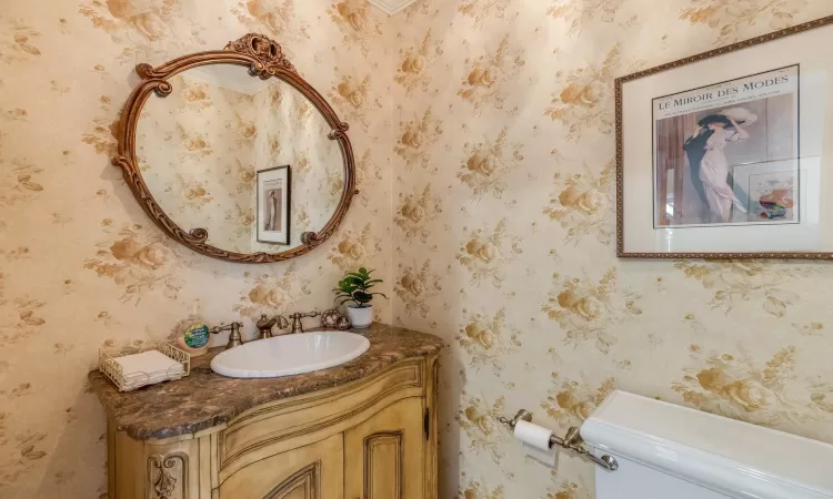 Bathroom featuring vanity and toilet