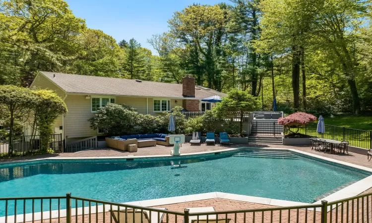 View of pool featuring a patio area and an outdoor hangout area