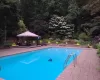 View of pool Gunite pool featuring a gazebo and a paver patio area