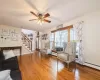 Livingroom with hardwood / wood-style floors, and ceiling fan.