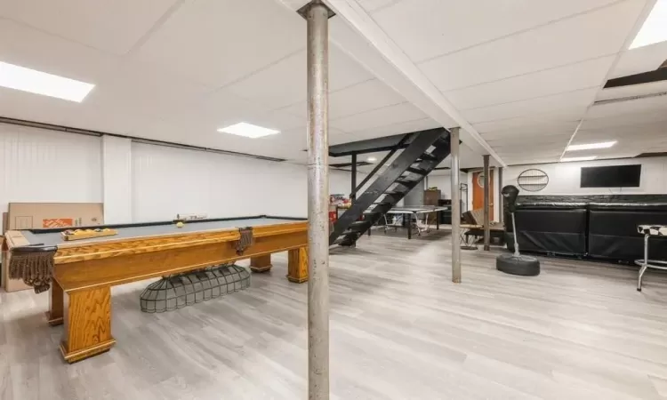 Game room with a drop ceiling, wood-type flooring, and pool table